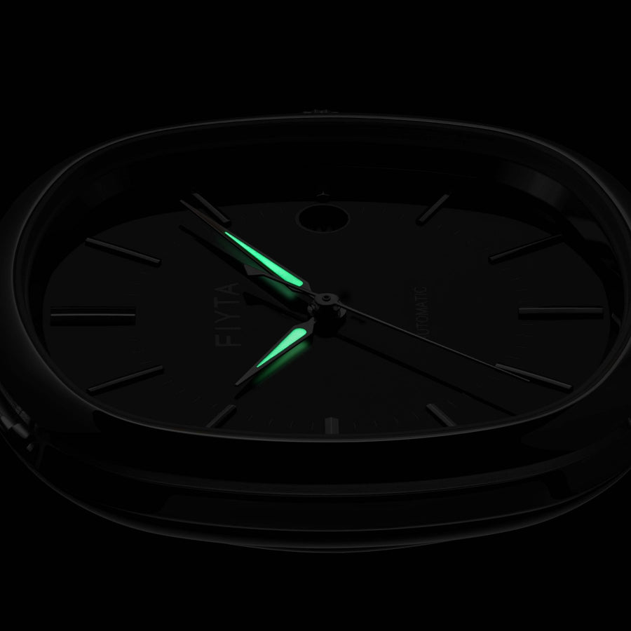 The hands on the FIYTA Tempered black-dial watch glowing green against a dark background. (GA850029.WBB)